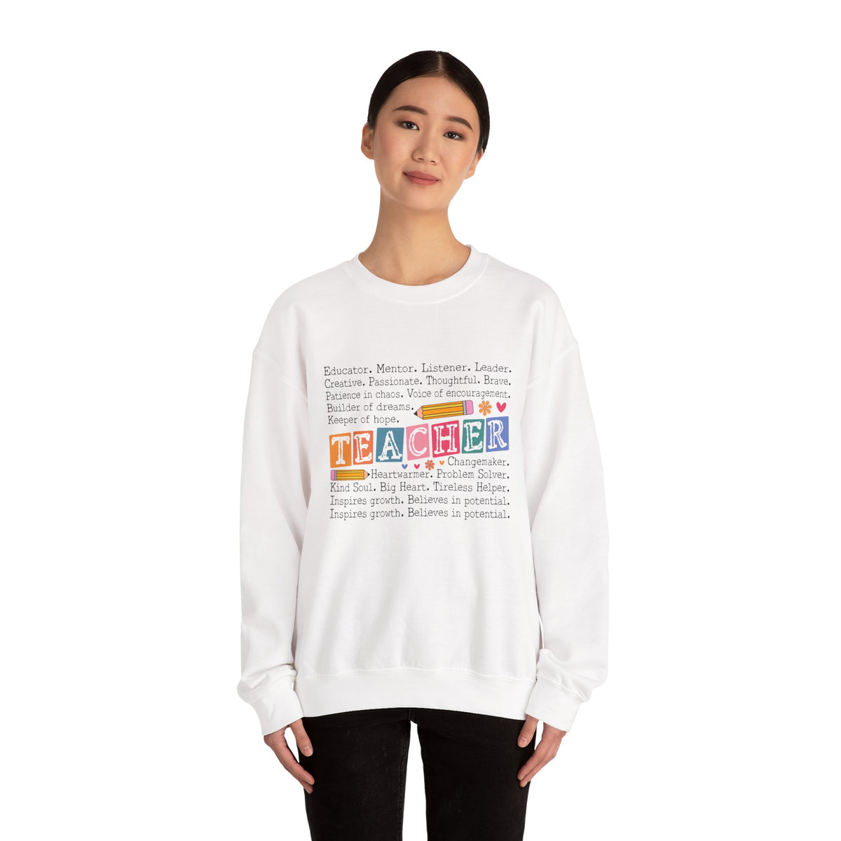 Person wearing a white sweatshirt with colorful text design on a white background