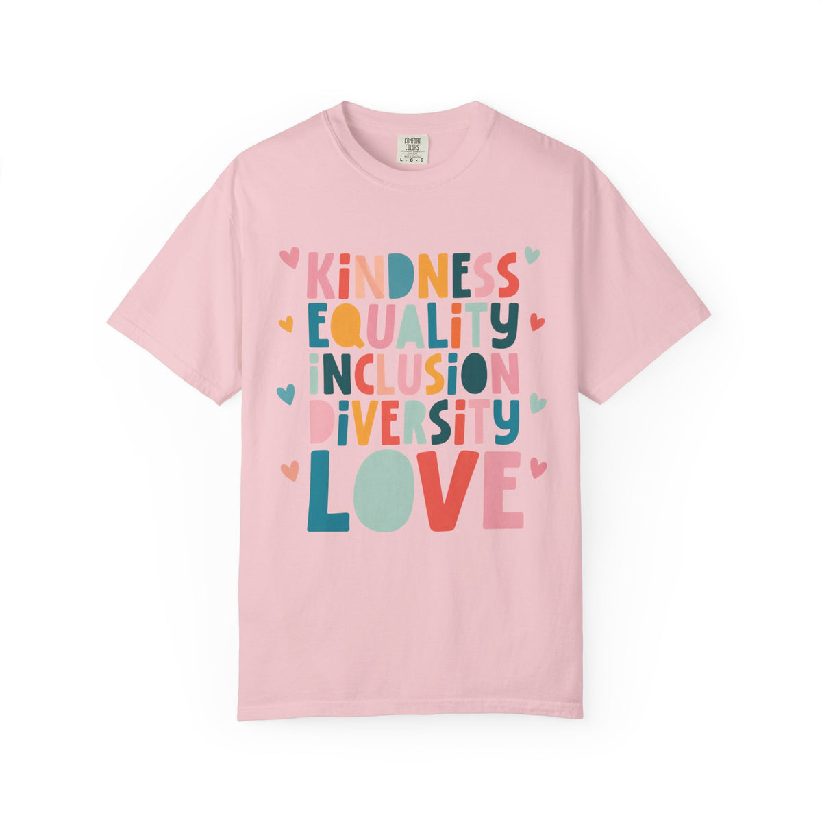 A light pink short-sleeve crewneck t-shirt featuring a colorful graphic print on the front with the words 'KINDNESS EQUALITY INCLUSION DIVERSITY LOVE' in stacked, multicolored bubble letters with small heart accents.