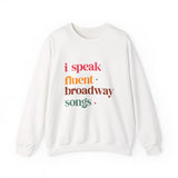 White sweatshirt with colorful text 'i speak fluent broadway songs' on a white background