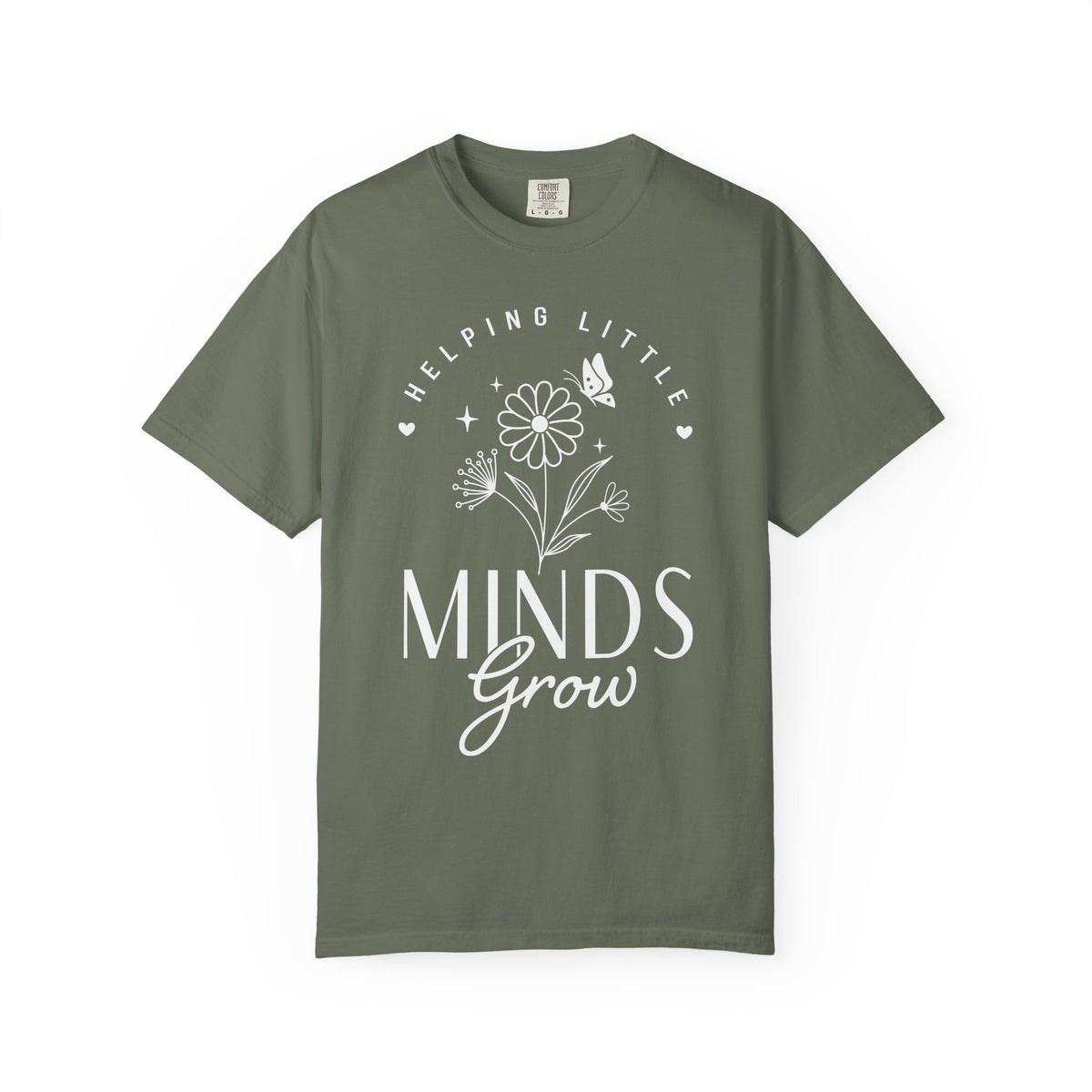 A green crewneck t-shirt with a white graphic print on the front that reads 'HELPING LITTLE MINDS Grow' with a flower and butterfly illustration, shown on a plain green background.