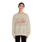 Person wearing a beige sweatshirt with colorful text design on a white background