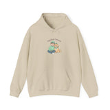 Beige hoodie with a graphic of a person and a dog on a white background