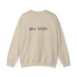 Beige sweatshirt with 'Mrs. Smith' text on the back against a white background