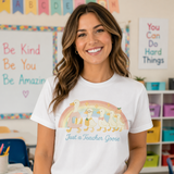 Woman wearing a white t-shirt with 'Just a Teacher Goose' design in a classroom setting