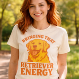 Woman wearing a t-shirt with a dog graphic and text in a park