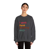 Person wearing a dark gray sweatshirt with colorful text on a white background