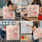Teacher tote bag with 'Teacher Mrs. Jones' text and strawberry design in a classroom setting.
