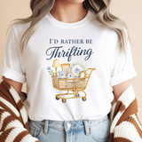 Person wearing a white t-shirt with 'I'd Rather Be Thrifting' graphic and text.