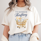 Person wearing a white t-shirt with 'I'd Rather Be Thrifting' graphic and text.